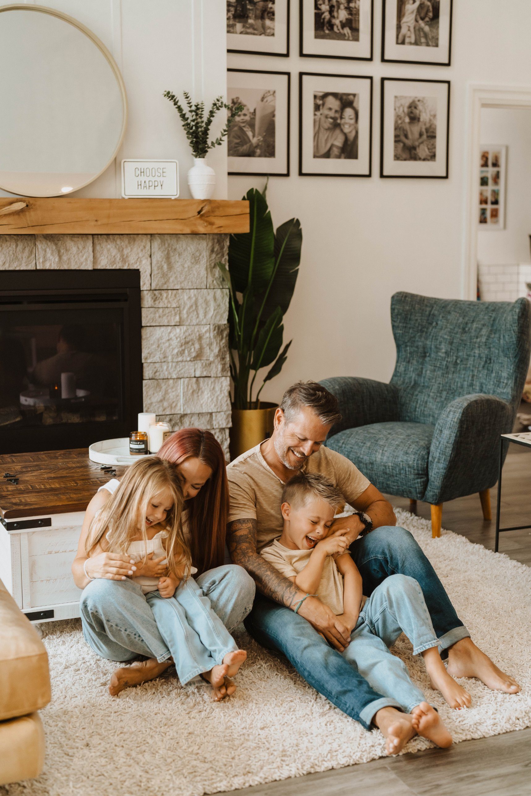 Ashley and her family laughing on the living room floor